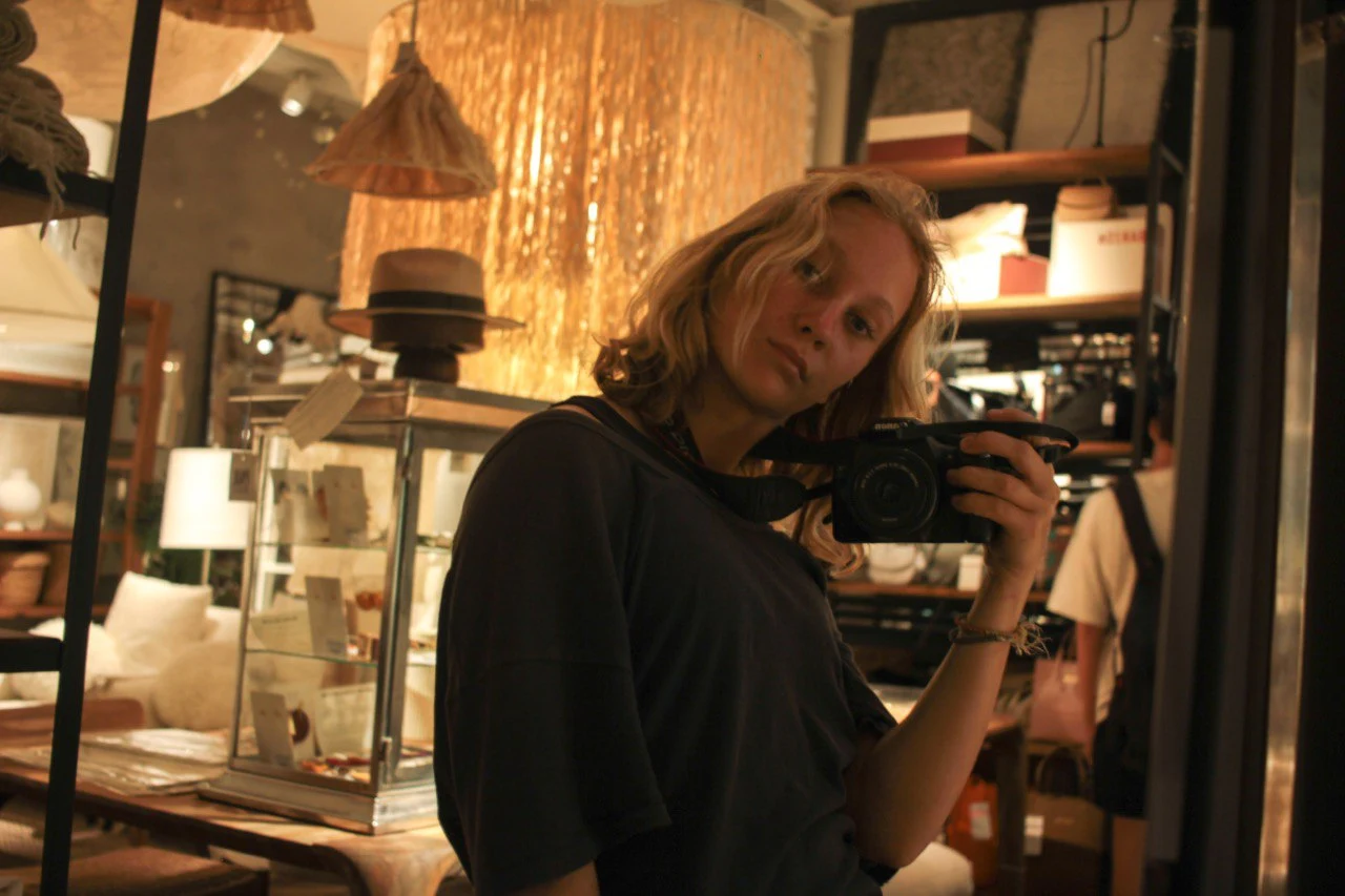 a woman with canon camera