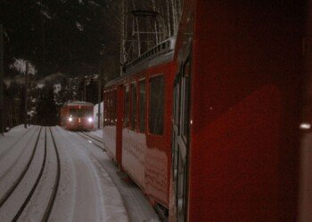 red train on mountains