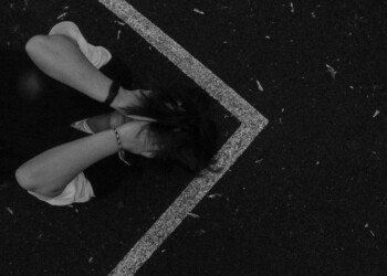 street photography where girl lying on on the ground