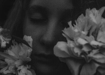 Woman's face with flowers in black and white style