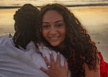 Couple embracing near the ocean in Nosara