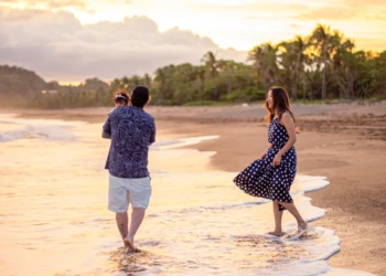 Family watching the sunset on a beach in Costa Rica