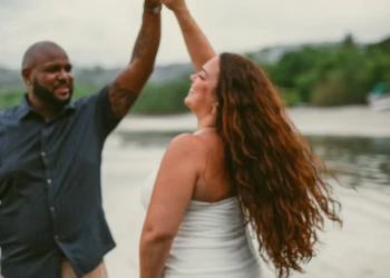 Couple standing by the ocean in Nosara, Costa Rica