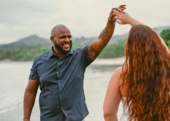 Couple standing by the ocean in Nosara, Costa Rica