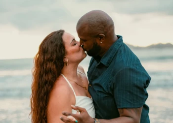 Couple embracing near the ocean in Nosara