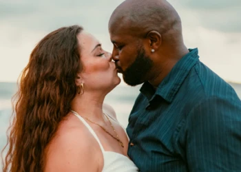 Couple embracing near the ocean in Nosara