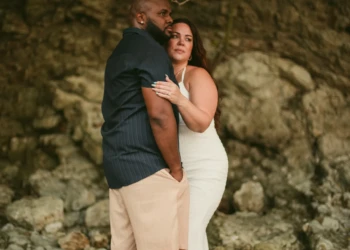 Couple posing together by the ocean in Nosara